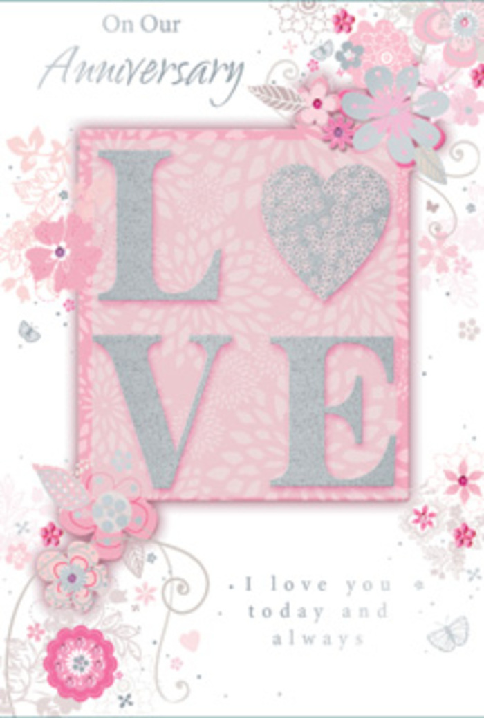The anniversary card depicted here radiates a gentle, enduring warmth, the kind of sentiment often shared in cosy homes across Merton after a long day. At its heart, the word LOVE stretches across the card in broad, raised lettering, each letter filled with a creamy white tone and edged in fine, pale glitter that shimmers subtly, like streetlights reflected on a rainy evening near South Wimbledon. The letters sit upon a blush-pink rectangle that gently contrasts with the surrounding soft pink background, giving the impression of a framed centrepiece. Embracing this central word is a delicate wreath of stylised blossoms and meandering foliage, drawn with fine, flowing lines that suggest the sketchwork of a florist mapping out a romantic bouquet before placing a single stem. The flowers are shaded in tones of blush, petal pink, ivory, and a whisper of silver-grey, their petals opening with an almost watercolour softness. Tendrils of leaves curl and arc around them, creating a sense of movement that feels like a gentle breeze passing through a garden in Ravensbury Park. Scattered across the card, graceful script text conveys loving anniversary messages-sentiments of gratitude, trust, and constancy-set in an elegant, slightly looping font that pairs effortlessly with the swirling vines and petals. The entire colour palette remains muted and soothing, without any harsh edges or overly bright tones, giving the card the intimacy of a whispered I love you rather than a shout. It feels like a hand-tied bouquet translated into paper form, perfectly suited to accompany anniversary flowers delivered around Merton as couples mark another cherished year together.