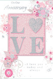 This anniversary card design offers a soft, romantic vision that would sit beautifully alongside a vase of fresh flowers in a Merton living room. In the centre, the word LOVE is rendered in raised, glitter-touched letters that gently sparkle, the glitter so fine it appears like a dusting of light across the creamy white surfaces. Each letter is outlined in subtle silver, giving them a sculpted, three-dimensional feel, as though they were carefully embossed by hand. The word rests on a blush-pink panel that stands out just enough from the paler pink background to create a quiet sense of focus. Around this, an array of delicate blooms and slender leaves swirl in gentle arcs, drawn in refined lines that recall the kind of thoughtful detailing seen in bespoke floral arrangements from local Merton florists. The florals are coloured in tender blush tones, pale ivory, and touches of silvery grey, suggesting softly opened petals and light sprays of foliage. The background remains a soft, even pink, giving a warm, tranquil stage for the artwork and script. Throughout the design, small flourishes-tiny petals, curling tendrils, and suggestions of little butterflies-add texture and a feeling of motion, like the stirring of leaves in the gardens of Morden Hall Park on a mild spring day. Interwoven with the floral swirls, elegant script phrases such as On Our Anniversary and I love you today and always appear in a refined, flowing font, reinforcing the card's message of lasting affection. The overall effect is of a thoughtfully balanced, bouquet-like card, ideal to accompany anniversary flower deliveries across Merton and nearby neighbourhoods.